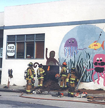 Firefighters cutting mural